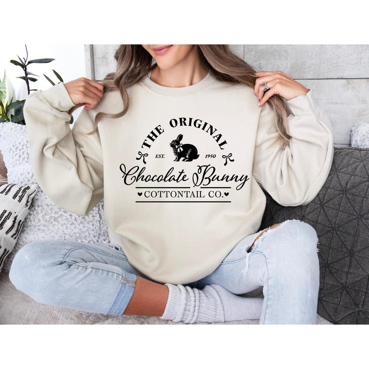 Timeless "Cottontail Co." chocolate bunny heat transfer with vintage-style elements, great for country-style fashion.