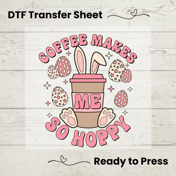 Coffee Makes Me So Hoppy DTF heat transfer featuring a coffee cup with bunny ears, pastel Easter eggs, and pink lettering, ready to press on t-shirts.