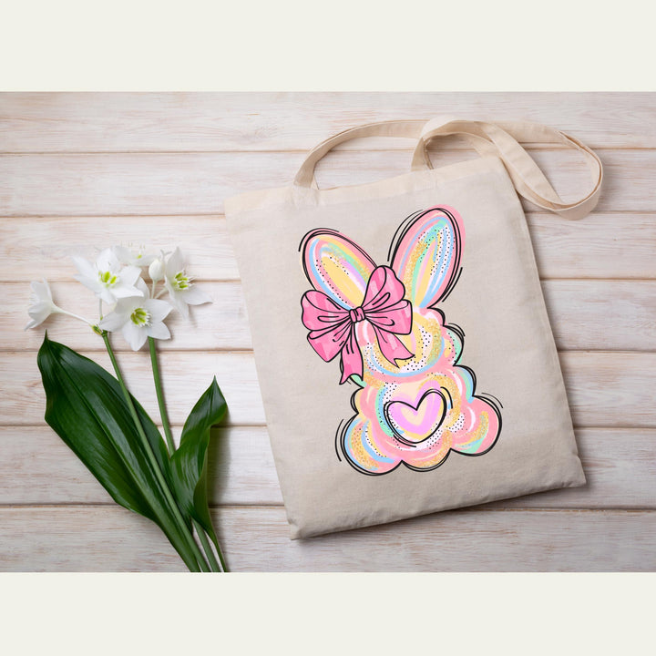 Easter-themed pastel bunny heat transfer with a playful pink bow, ideal for DIY t-shirts and baby outfits.