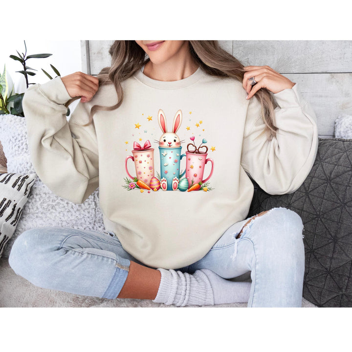Adorable Easter-themed DTF transfer featuring pastel coffee cups, a bunny, stars, and spring-inspired decorations.