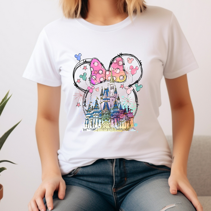 A colorful DTF transfer showcasing a fantasy castle inside a Minnie ears outline with Mickey balloons and fireworks.