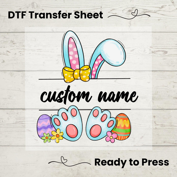 Easter Bunny Ears Custom Name DTF heat transfer featuring bunny ears, colorful eggs, and a custom name option, ready to press on t-shirts.