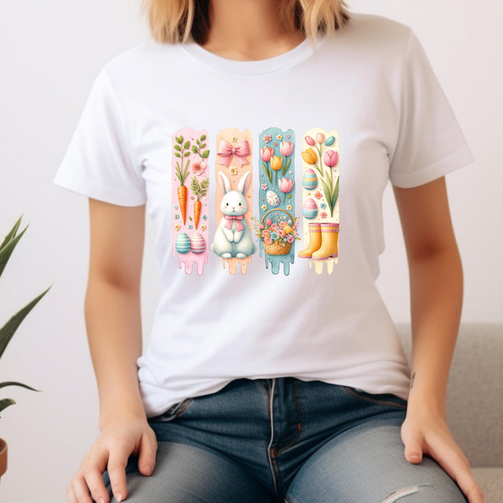 A cute spring transfer sheet with bunny, carrots, tulips, floral basket, and pastel Easter eggs.