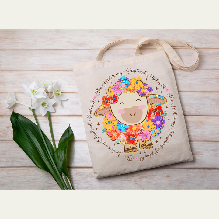 Faith-based Easter heat transfer with a bright floral lamb design and Bible verse, perfect for Christian fashion.