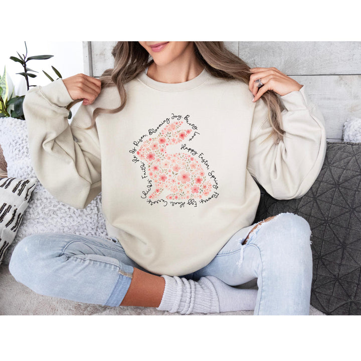 A soft pink floral bunny surrounded by script words like "Happy Easter," "Blooming," and "Springtime Joy."

