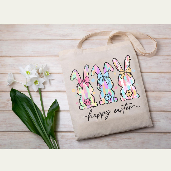aster transfer with colorful brushstroke bunnies, floral accents, and bows, perfect for DIY t-shirts and tote bags.
