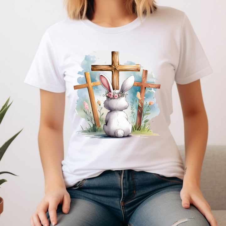  A meaningful Easter design showing a bunny facing three crosses, symbolizing faith and the resurrection.