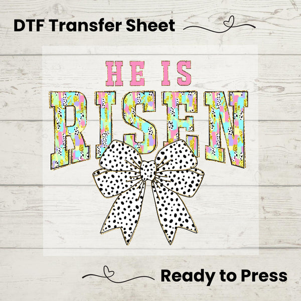DTF Transfer featuring "He Is Risen" with bold patterned letters and a polka dot bow – perfect for Easter fashion.