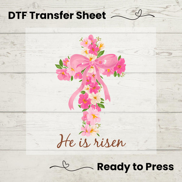 DTF Transfer featuring a pastel floral cross with pink bow and "He Is Risen" text – perfect for Easter apparel.