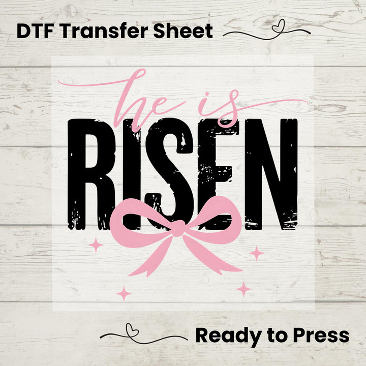 Christian Easter DTF transfer featuring "He Is Risen" in bold typography with a pink bow and decorative accents.