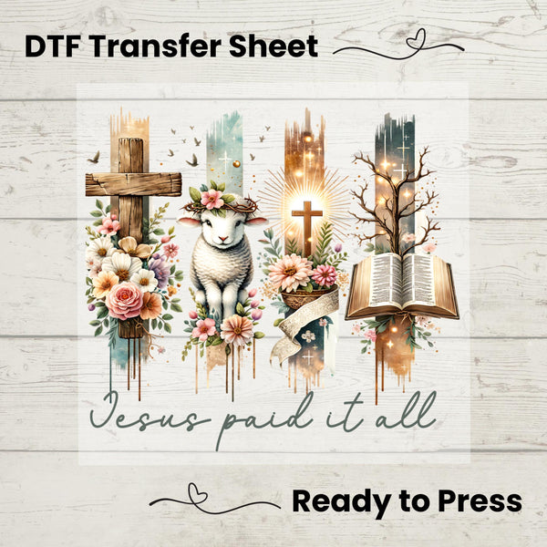 DTF Transfer featuring a wooden cross, lamb, glowing cross, and Bible with "Jesus Paid It All" message – perfect for faith-based apparel.