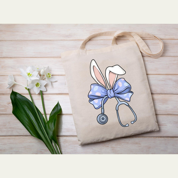 Medical-themed Easter heat transfer with a fun bunny and stethoscope design, ready to press on scrubs and t-shirts.