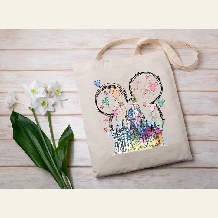 Canvas tote bag with a pastel Mickey ears and castle DTF transfer, perfect for custom gift shops or vacation bags.