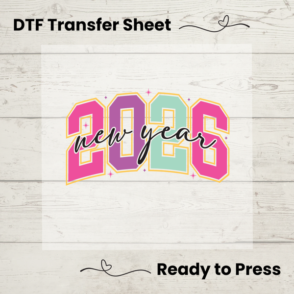 DTF transfer sheet with '2023 new year' text on a wooden surface