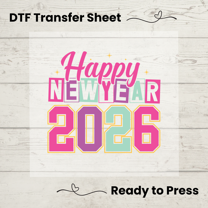 Happy New Year 2026 DTF transfer sheet on a wooden surface