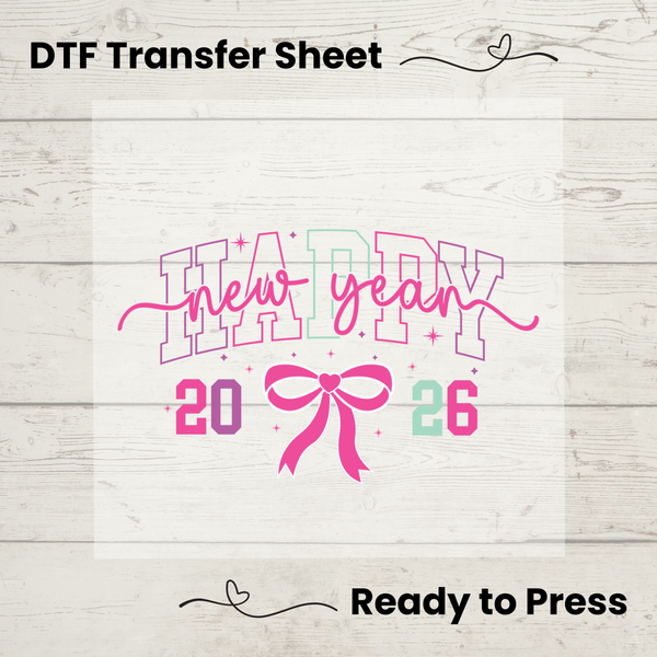 DTF transfer sheet with 'Happy New Year 2026' design on a wooden surface