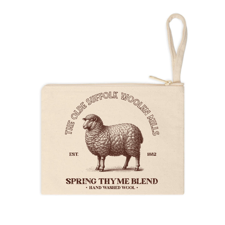 Vintage-inspired transfer featuring a Suffolk sheep and "Olde Suffolk Woolen Mills" branding, designed for rustic apparel.


