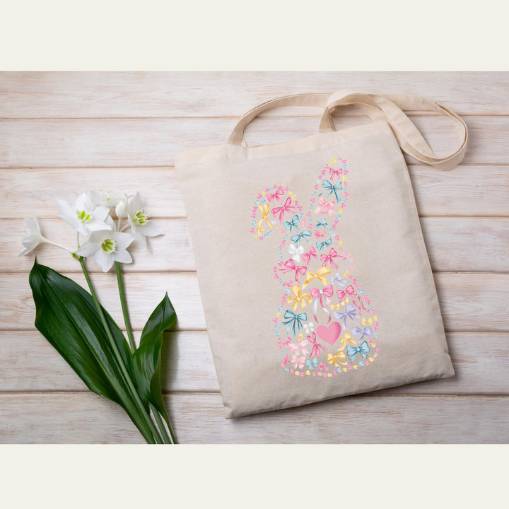 A playful Easter-themed DTF transfer featuring a bunny shape filled with colorful bows and hearts.