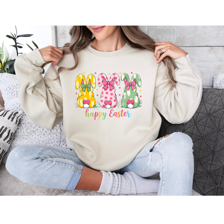 Vibrant yellow, pink, and green bunny silhouettes with bows and rainbow "Happy Easter" lettering for spring crafts.