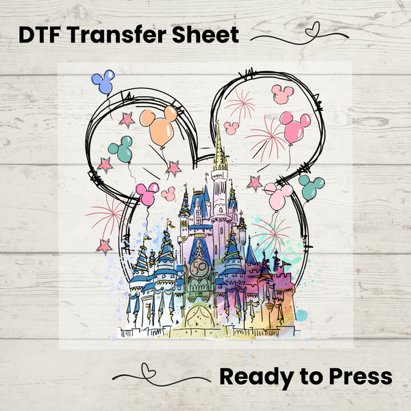 Direct-to-film transfer featuring a pastel fairytale castle inside Mickey ears with fireworks and balloon details.