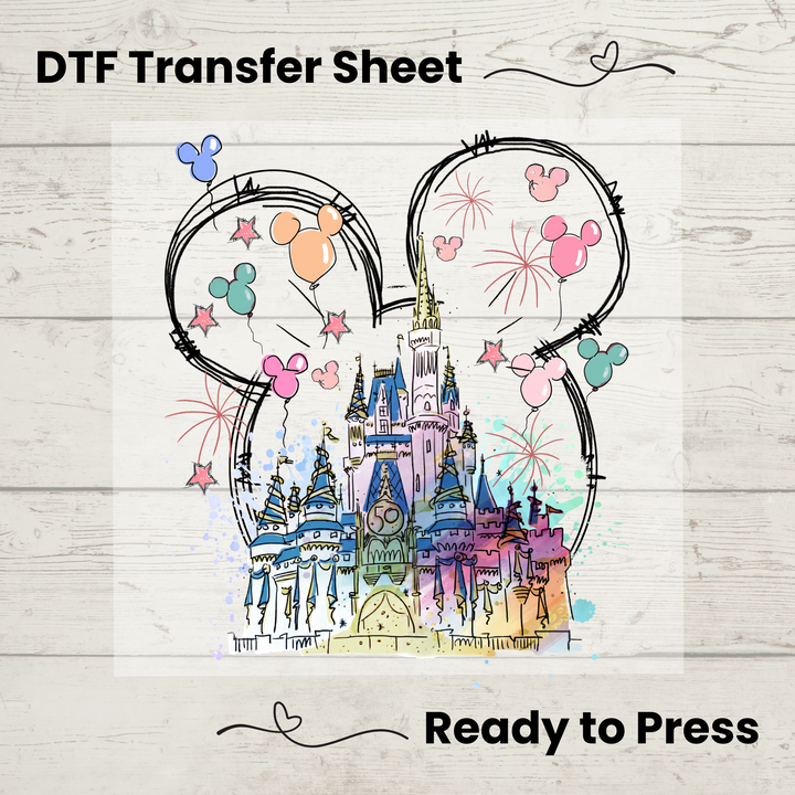Direct-to-film transfer featuring a pastel fairytale castle inside Mickey ears with fireworks and balloon details.