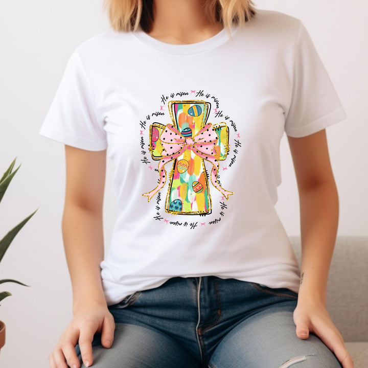 High-quality ready-to-press Easter DTF heat transfer with a colorful cross, He Is Risen script, and gold sparkle details