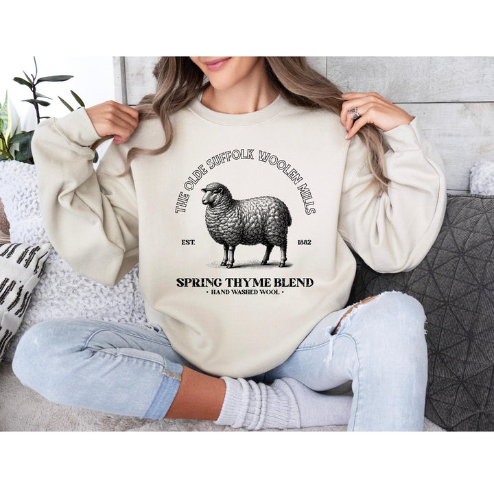 Hand-drawn Suffolk sheep illustration with antique typography, ideal for farmhouse-style fashion and home décor.

