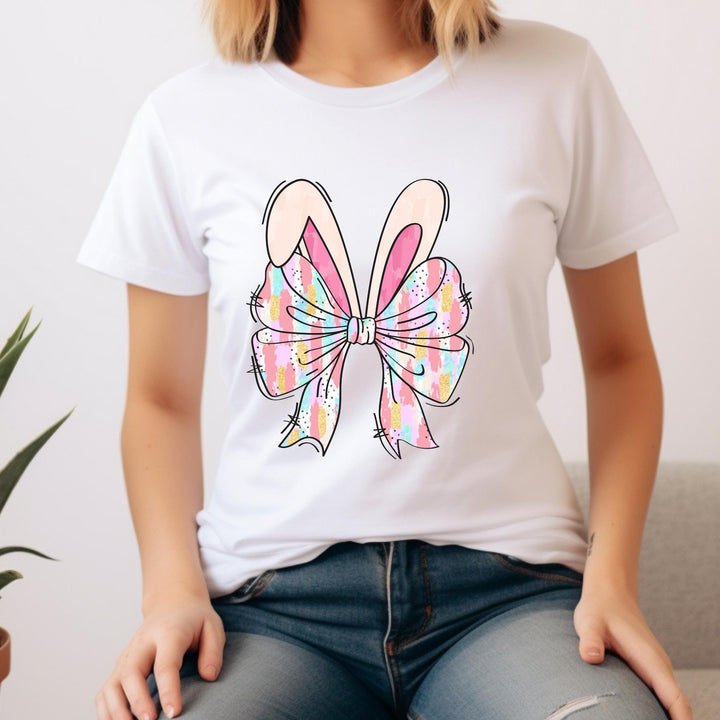 A trendy Easter-themed transfer featuring a large pastel bow and adorable bunny ears for custom apparel.