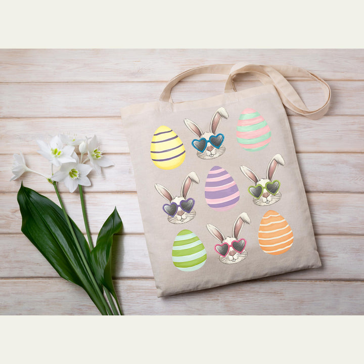 Trendy pastel-striped Easter egg and bunny heat transfer with a coquette-inspired design, perfect for spring fashion lovers.