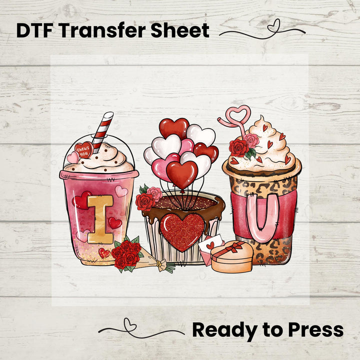 A colorful digital image of two coffee cups with hearts and the text 'I love you' on one of the cups, designed as a DTF transfer sheet for Valentine's Day, indicating it's ready to be pressed onto fabric.