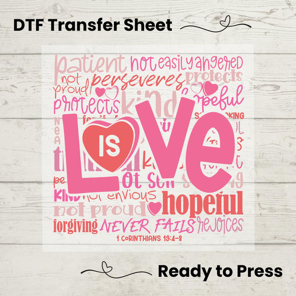A graphic design of the word 'Love' made from words related to love, patience, and kindness, with a heart and the Bible verse 1 Corinthians 13, printed in pink on a white background, indicating it is a DTF (Direct to Film) transfer sheet ready to be pressed onto fabric.