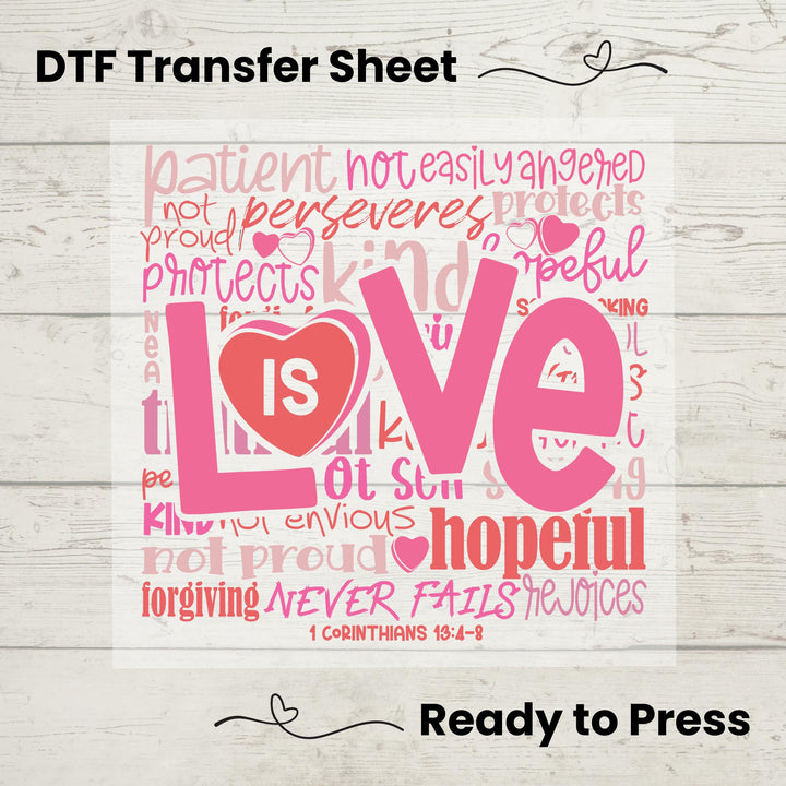 A graphic design of the word 'Love' made from words related to love, patience, and kindness, with a heart and the Bible verse 1 Corinthians 13, printed in pink on a white background, indicating it is a DTF (Direct to Film) transfer sheet ready to be pressed onto fabric.