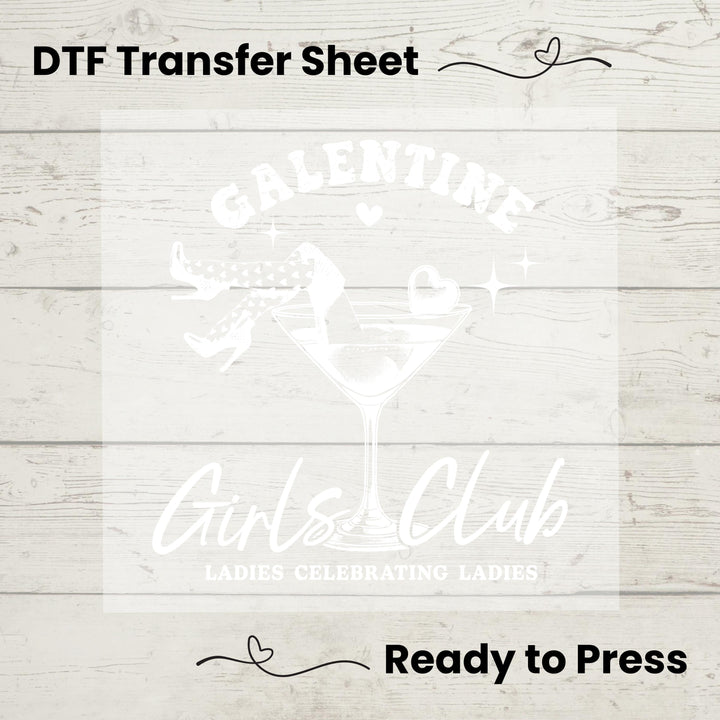 A graphic design on a DTF transfer sheet with the text 'GALENTINE Girls Club' depicting a stylized martini glass and a character, set against a wood panel background. The sheet is labeled as 'Ready to Press'.