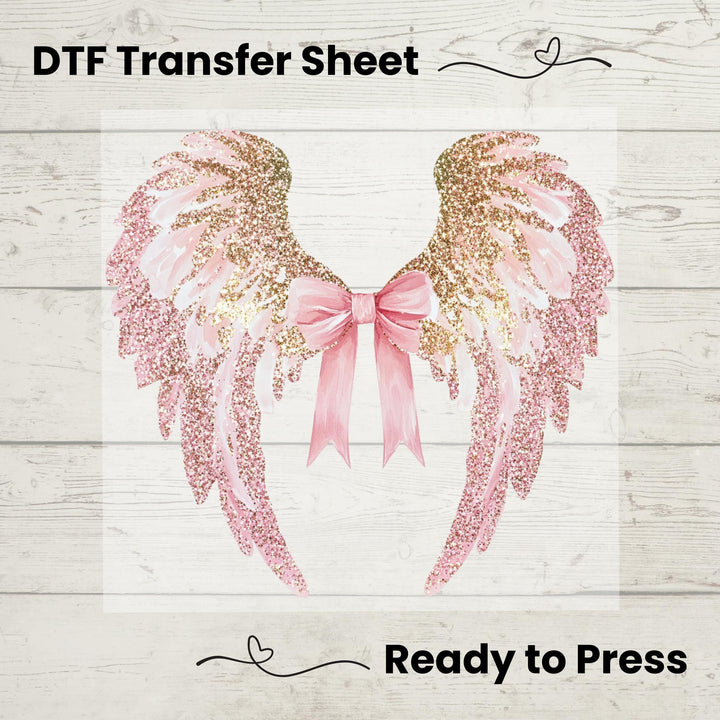 A graphic image of pink and gold wings with a bow, designed as a DTF transfer sheet for application on garments.