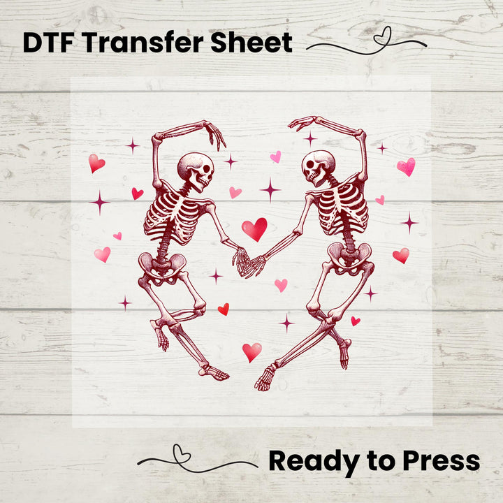 A graphic design of two skeletons dancing with hearts around on a white background, labeled as a DTF Transfer Sheet.