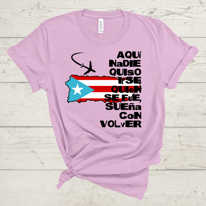 Lilac t-shirt with Puerto Rican flag and text on a wooden surface