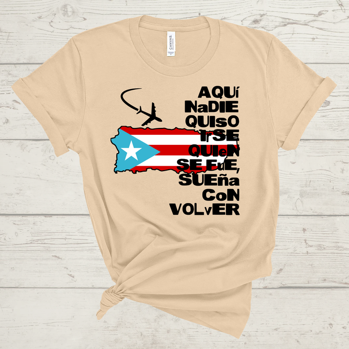 Tan t-shirt with Puerto Rican flag and text on a wooden surface