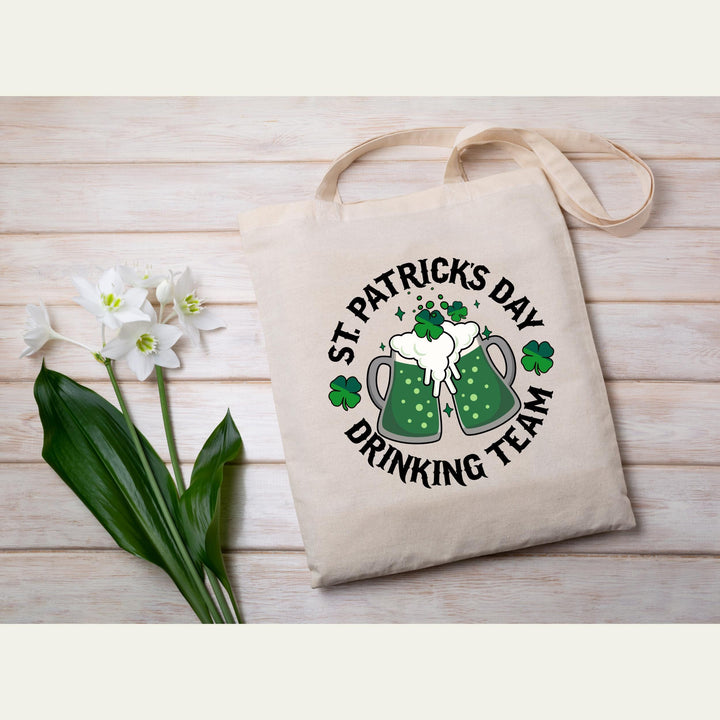 St. Patrick’s Day Drinking Team DTF transfer with two festive green beer mugs, shamrocks, and bold text, ideal for DIY festive apparel