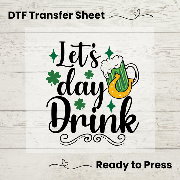 Funny Let’s Day Drink St. Patrick’s Day DTF transfer featuring shamrocks, a lucky horseshoe, and a festive green beer mug for DIY matching shirts.