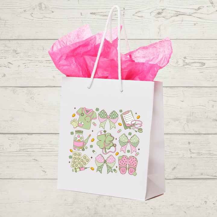 St. Patrick’s Day Nurse DTF transfer featuring coquette aesthetic, pastel pink and green nurse graphics including stethoscopes, scrubs, bows, and crocs.