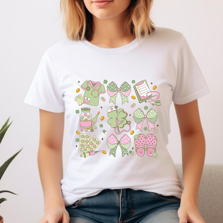 St. Patrick’s Day Nurse DTF transfer featuring coquette aesthetic, pastel pink and green nurse graphics including stethoscopes, scrubs, bows, and crocs.