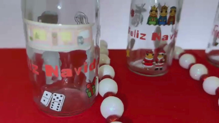 coquito bottles with Puerto rico themed christmas designs