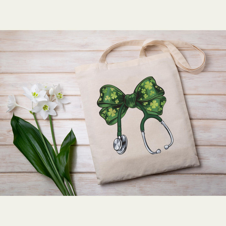 St. Patrick’s Day Nurse DTF transfer featuring a green coquette bow with shamrocks on a stethoscope, ideal for DIY nurse and medical apparel.