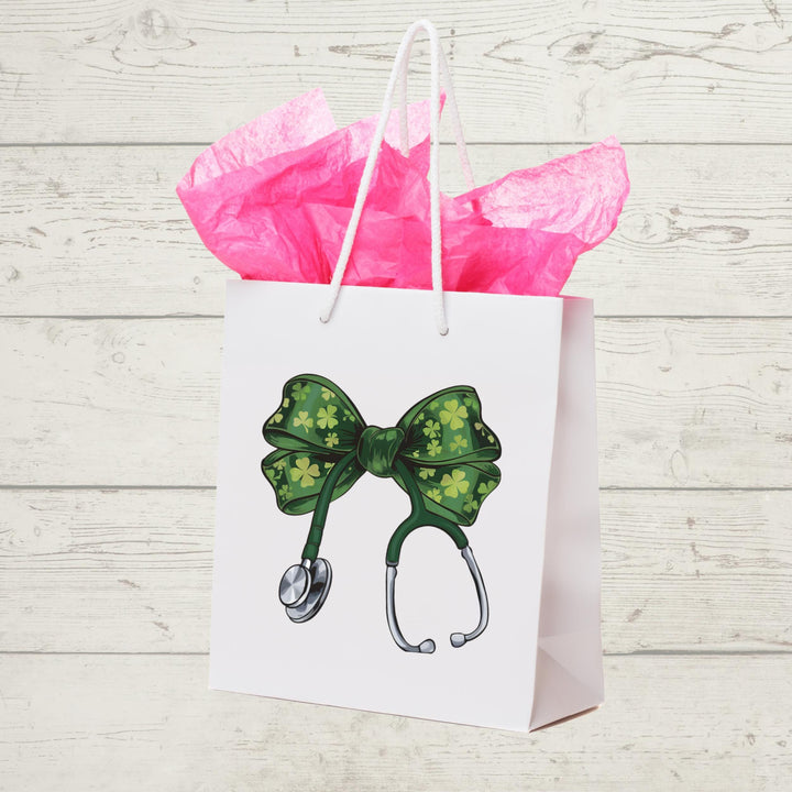 St. Patrick’s Day Nurse DTF transfer featuring a green coquette bow with shamrocks on a stethoscope, ideal for DIY nurse and medical apparel.