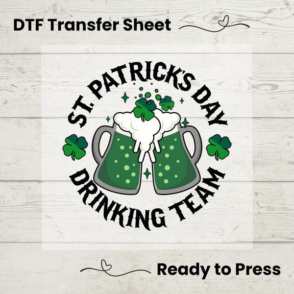 St. Patrick’s Day Drinking Team DTF transfer with two festive green beer mugs, shamrocks, and bold text, ideal for DIY festive apparel