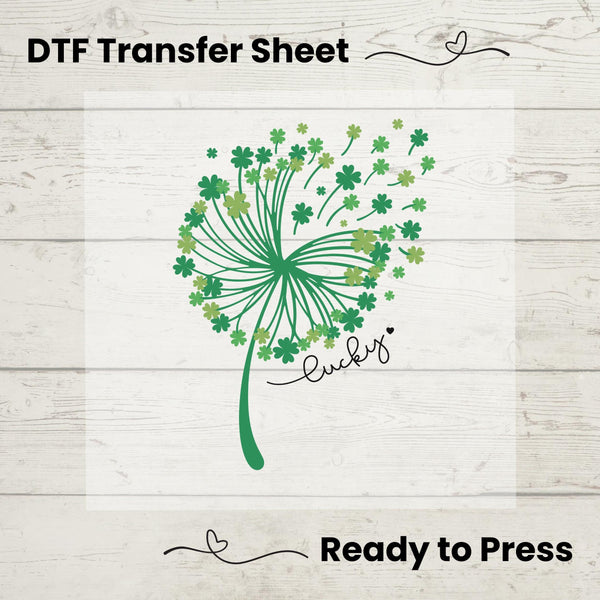 St. Patrick’s Day DTF transfer sheet featuring an elegant whimsical dandelion composed of green shamrocks with 'Lucky' text, ideal for DIY apparel.