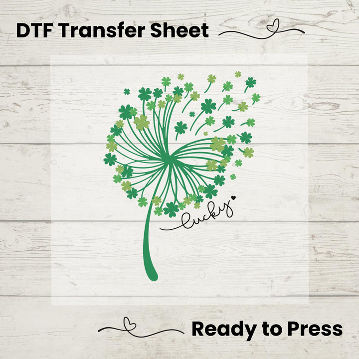 St. Patrick’s Day DTF transfer sheet featuring an elegant whimsical dandelion composed of green shamrocks with 'Lucky' text, ideal for DIY apparel.