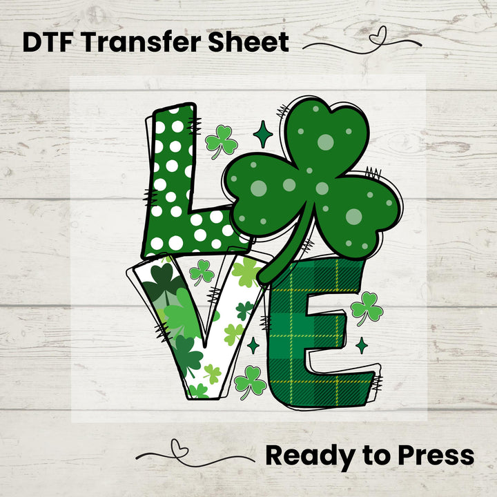 St. Patrick’s Day LOVE DTF transfer sheet featuring bold lettering with shamrocks, polka dots, and green plaid patterns for festive DIY apparel