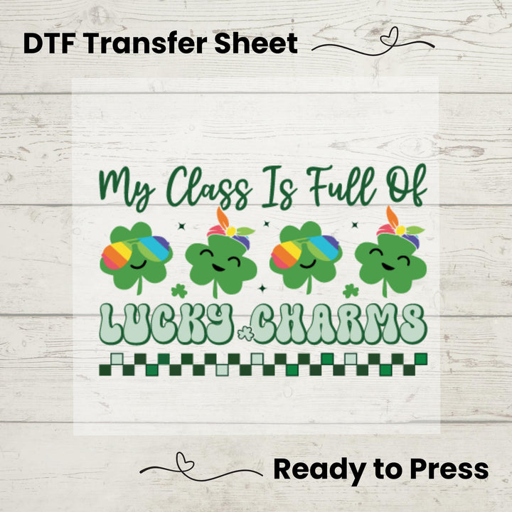 A graphic design on a white background depicting multiple rainbow-colored lucky charms and shamrocks with the text 'My Class Is Full Of Lucky Charms' arranged in a line.