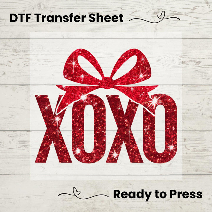 A graphic image of a red sequin 'XOXO' text on a white background, indicating it is a design for a heat transfer vinyl sheet, ready to press onto fabric.